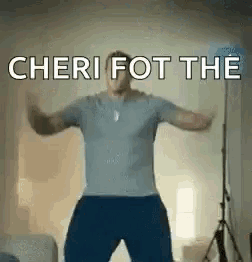a man is dancing in a living room with the words cheri fot the written on the bottom .