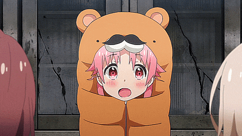 a girl with pink hair is wearing a bear costume