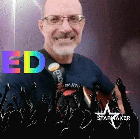 a man playing a guitar in front of a crowd with the name ed on the top