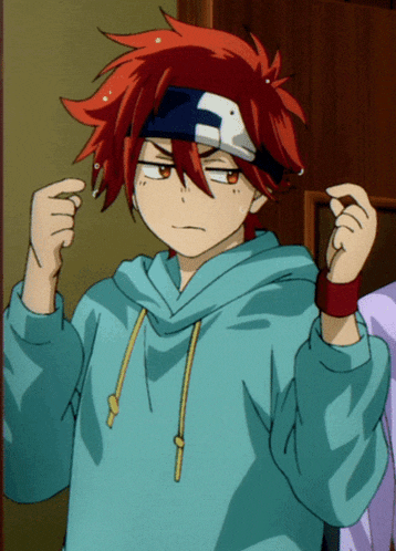 a boy with red hair is wearing a blue hoodie and a headband