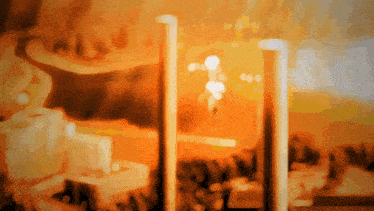 a blurred image of a person standing in front of a fire place