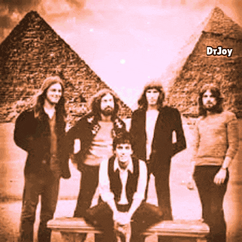 a group of people standing in front of pyramids with the name drjoy on the bottom