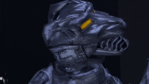 a close up of a robot 's head with a yellow light coming out of it