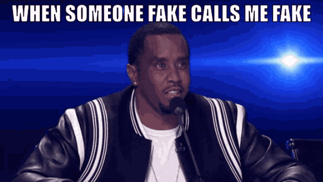 a man sitting in front of a microphone with the words when someone fake calls me fake