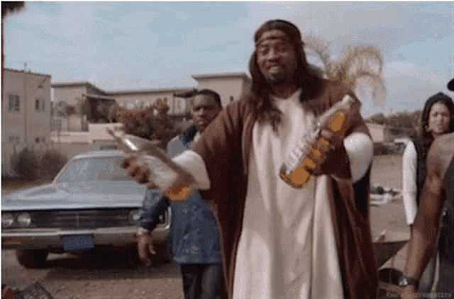 a man dressed as jesus holding a bottle of beer