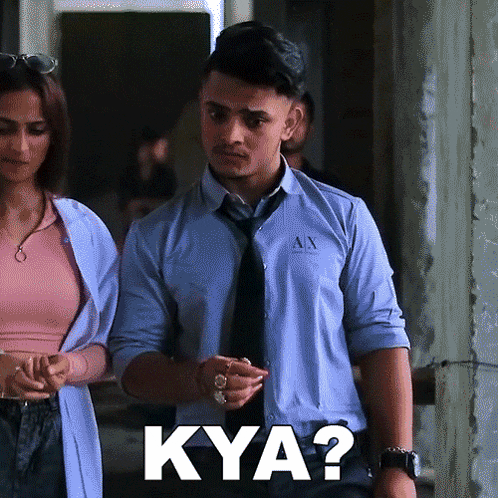 a man in a blue shirt and tie says kya ?