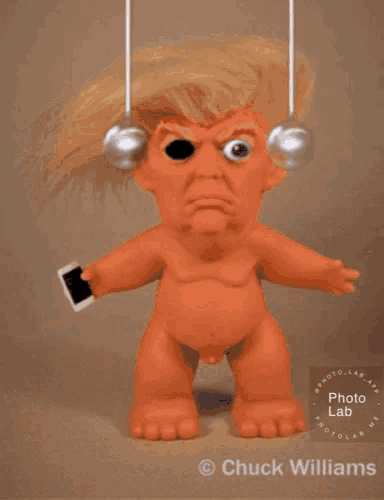 a picture of a naked trump doll by chuck williams is displayed