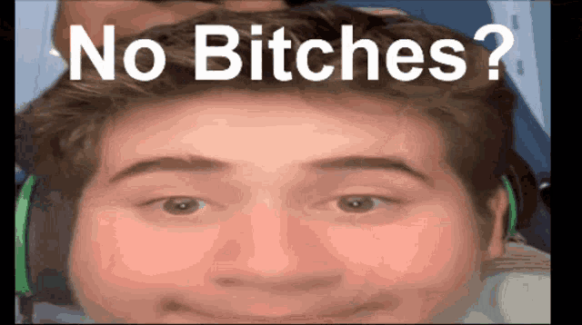 a close up of a man 's face with the words no bitches above it