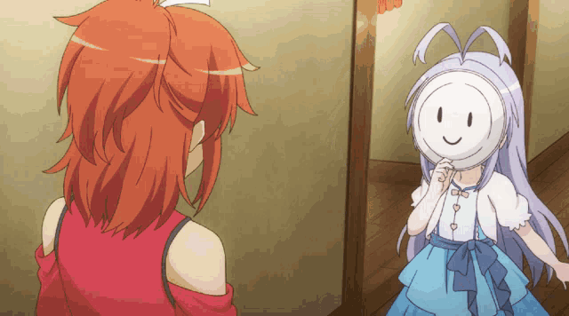 a girl with a smiley face on her face looks at another girl