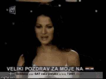 a woman is crying on a tv screen with the words ma zelene oci