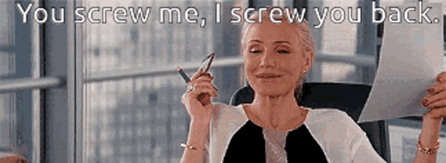a woman is holding a pen and a piece of paper with the words you screw me i screw you back