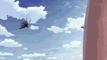 a spider is flying through the air next to a giant pillar .