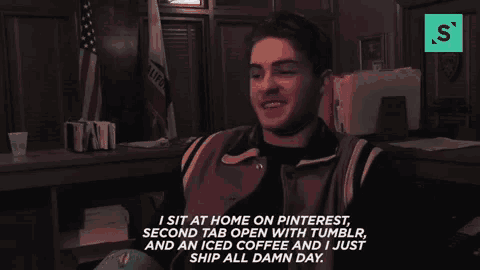 a man is sitting in a dark room talking about pinterest