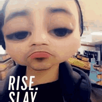 a man is wearing headphones and making a funny face with the words rise slay in the corner .