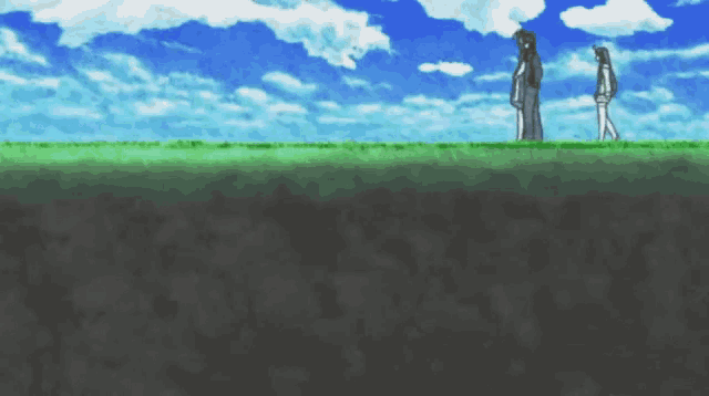 a couple of people standing in a field with a blue sky behind them
