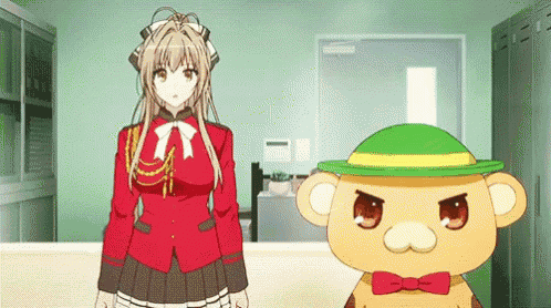 a girl in a red uniform is standing next to a teddy bear wearing a green hat and bow tie .