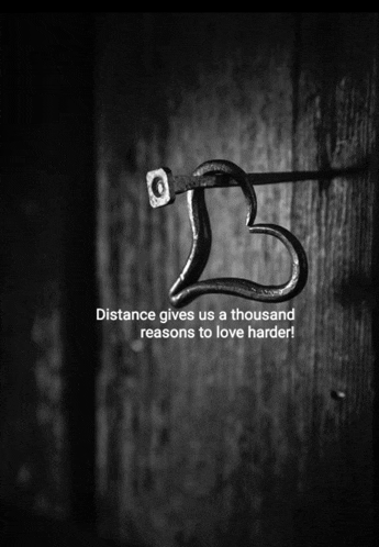 a black and white photo of a heart shaped hook with the words distance gives us a thousand reasons to love harder below it