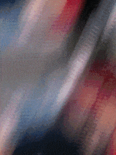 a blurry image of a red white and blue striped fabric