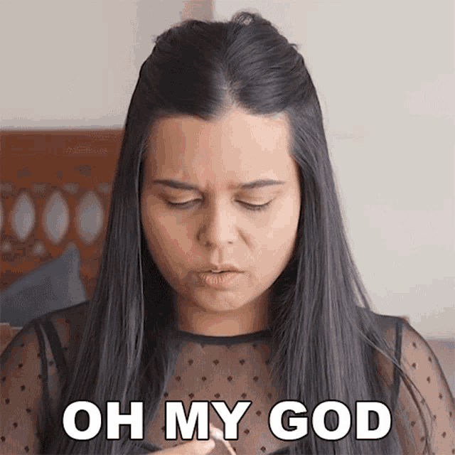 a woman with long black hair is making a funny face and says oh my god