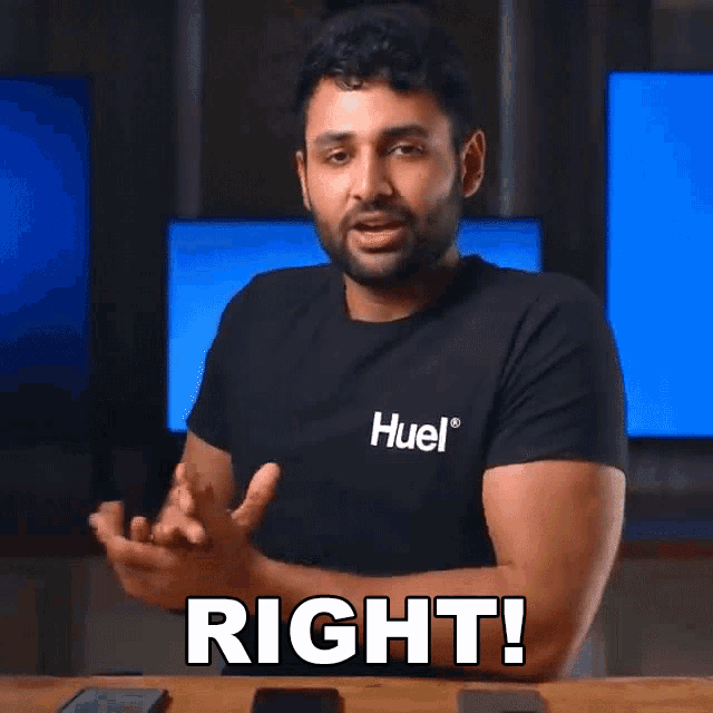 a man wearing a black t-shirt with the word huel on it