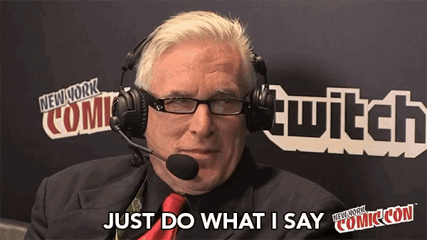 a man wearing headphones and a red tie says just do what i say