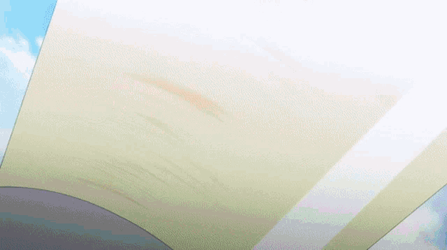 a large piece of paper is flying through the air in the sky .