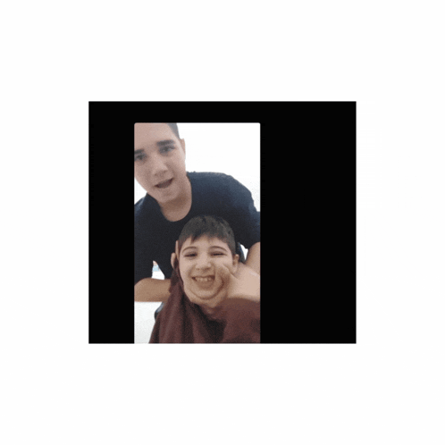 a man is giving a boy a piggyback ride and the boy is smiling