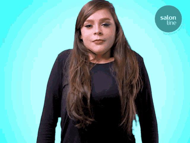 a woman in a black shirt is standing in front of a blue background that says salon line