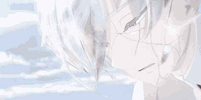 a close up of a person 's face with a blue sky in the background