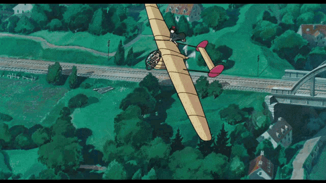 a cartoon plane is flying over a bridge