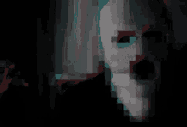a close up of a person wearing a white ski mask in the dark .