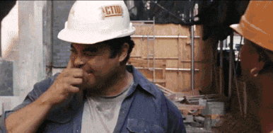 a man wearing a hard hat with action on it
