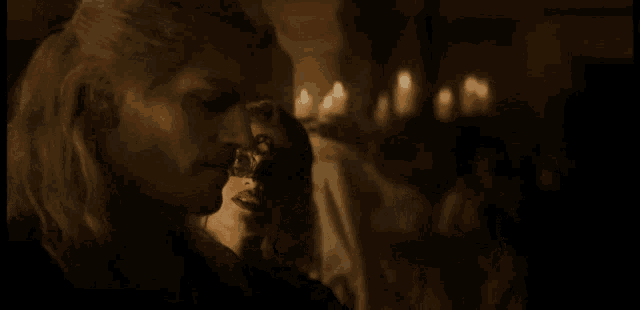 a woman wearing a mask is kissing another woman