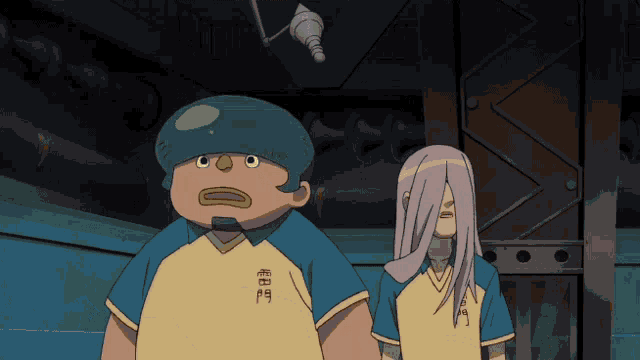 a man with a green hat and a woman with long white hair are standing next to each other in a room