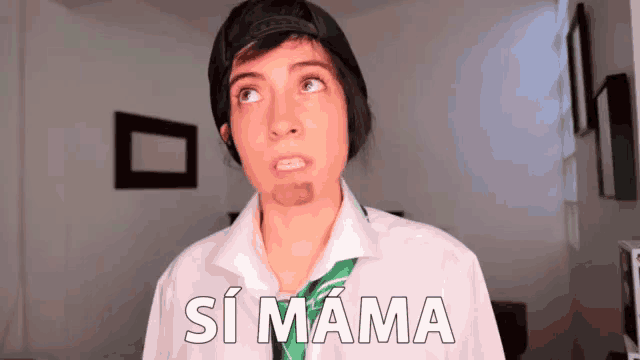 a woman wearing a white shirt and green tie says si mama in white letters