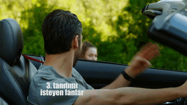 a man is driving a car with the words " 3. tantimi isteyen fanlar " on the bottom