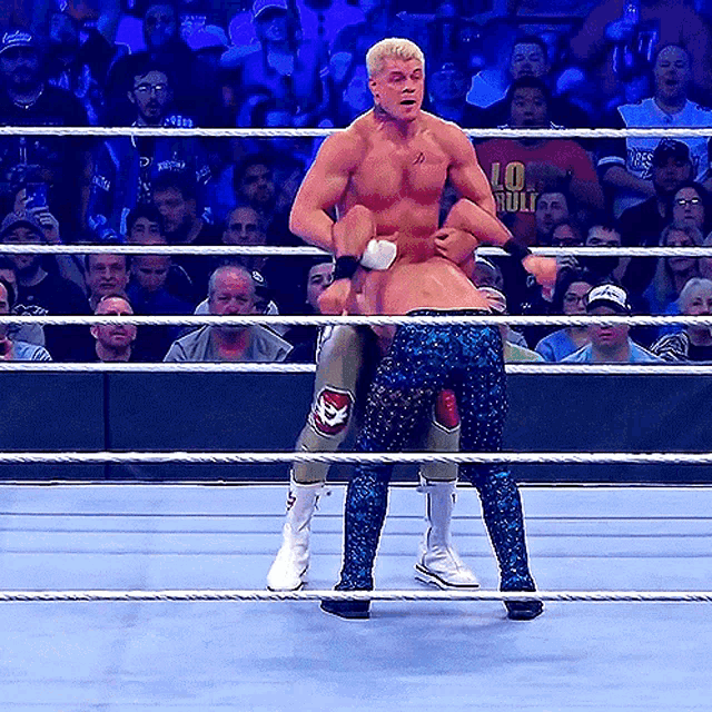a man in a wrestling ring with a shirt that says ' hulk ' on it