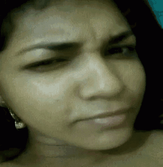 a close up of a woman 's face with her eyes closed