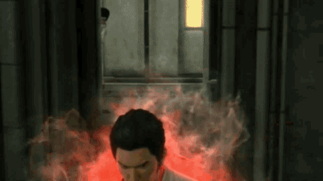 a man in a video game is surrounded by red smoke .