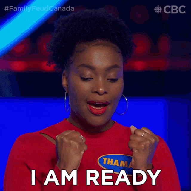 a woman wearing a red shirt that says thama on it