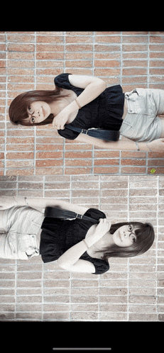 two women standing in front of a brick wall one in a black top and the other in white shorts