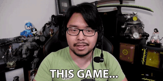 a man wearing glasses and a headset says " this game "
