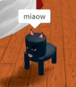 a black cat is sitting on a small chair on a wooden floor with a speech bubble that says miaow .