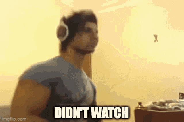 a man wearing headphones says " didn 't watch " in a gif