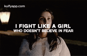 a woman is fighting like a girl who does n't believe in fear