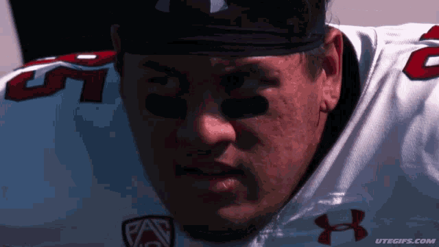 a close up of a football player wearing a headband with the number 51 on it