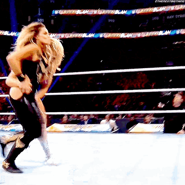 a woman in a wrestling ring with the word slam on the bottom