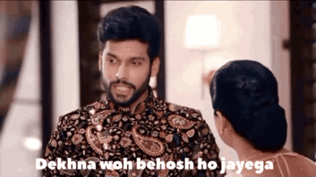 a man and a woman are looking at each other with a caption that says " dekhna woh behosh ho jayega "