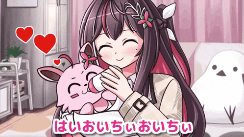 a girl is feeding a baby from a bottle in a room with japanese writing on the bottom right
