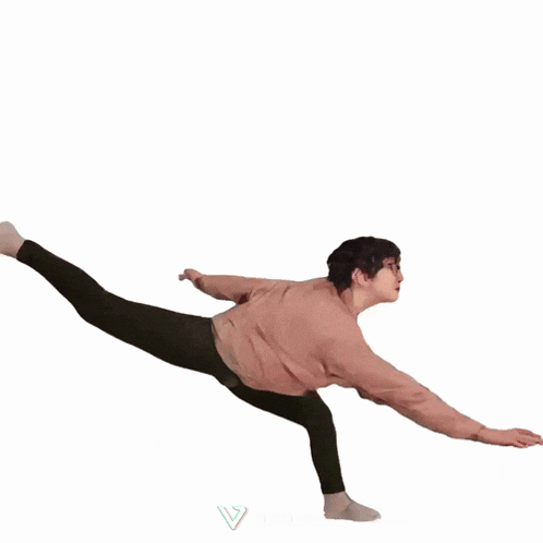 a person wearing a pink nike sweatshirt is doing a trick